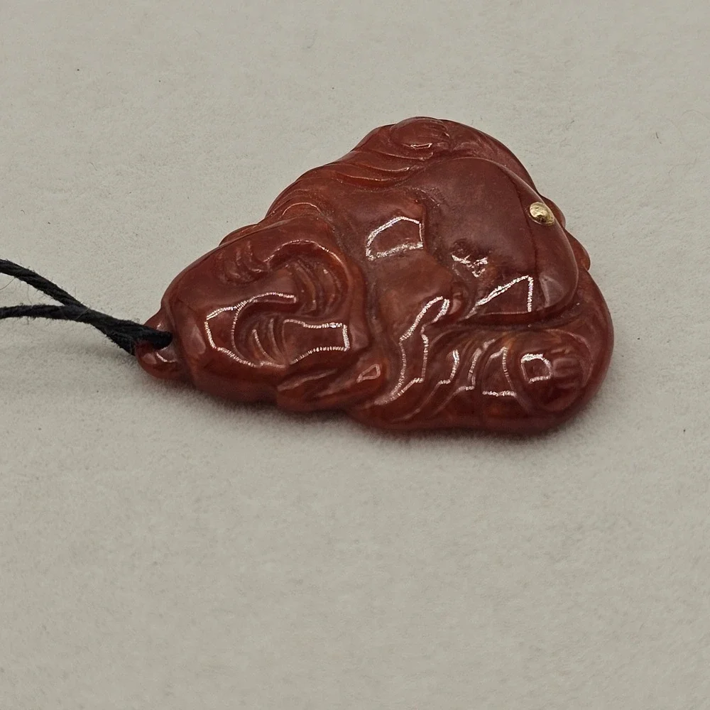 Carved Red Stone Laughing Buddha Pendant Black Cord Necklace Gold Tone Accent